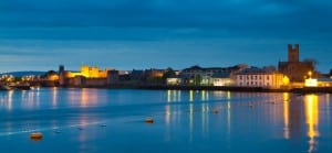 ECOS Environmental Consultants - Limerick city at night showing King John's Castle, Limerick City Council offices and St Marys Cathedral